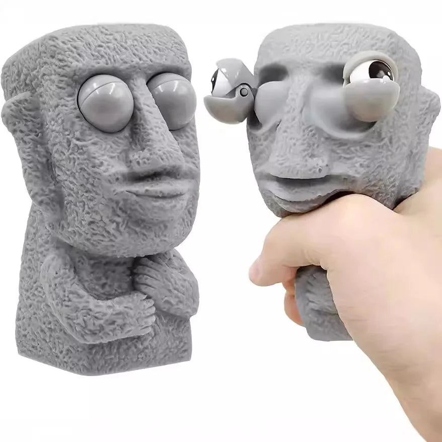 Stone man releases stress toy slowly rebounds soft Moai statue squeeze