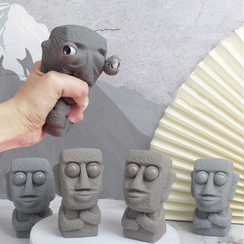 Stone man releases stress toy slowly rebounds soft Moai statue squeeze